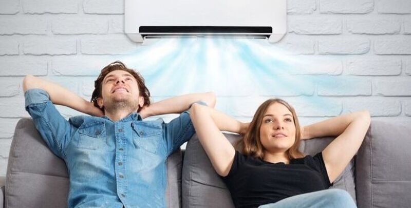 A couple relaxes in air conditioning